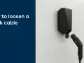 En svart Easee laddbox med en laddkabel som sitter fast. Texten "How to loosen a stuck cable" visas.