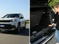 Vit Jeep Compass kör på en väg, en kvinna inspekterar bagageutrymmet. En del av en jeep compass test.