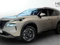 A tan Nissan X-Trail e-POWER SUV is shown from the front three-quarter view in a showroom.