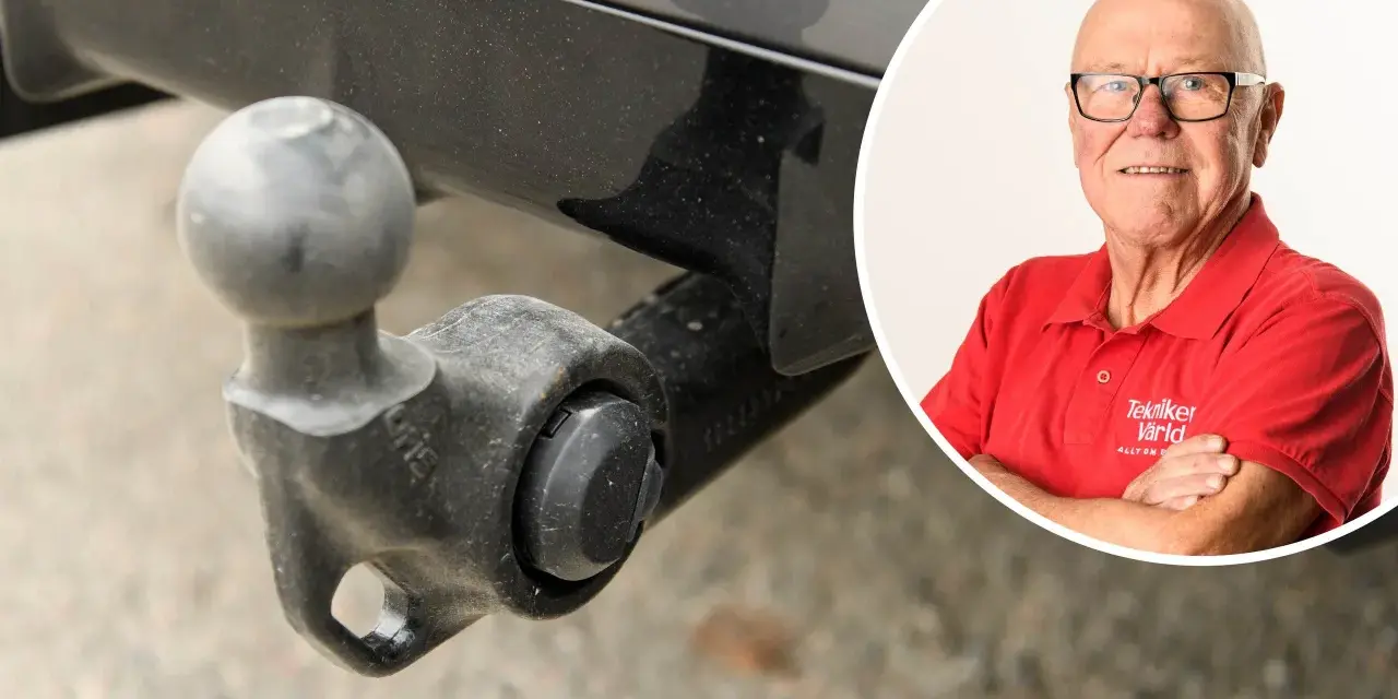 En man i röd tröja med texten "Tekniker Värld" ler, bredvid en bil med dragkrok. Dags att ta bort dragkrok?