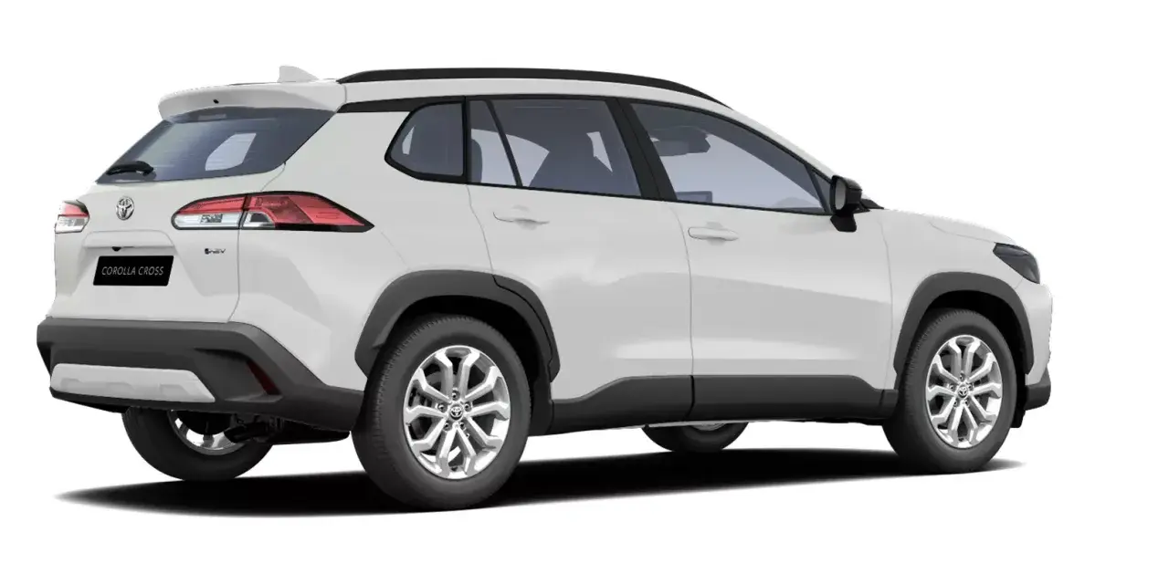 Vit Toyota Corolla Cross, redo för ett test. Denna SUV kombinerar stil med praktiskhet.