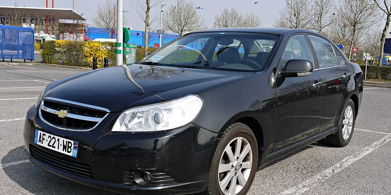 Black Chevrolet Epica sedan parked in a lot, front view.
