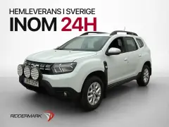 Vit Dacia Duster med extraljus, redo för ett däcktest. Hemleverans inom 24h.