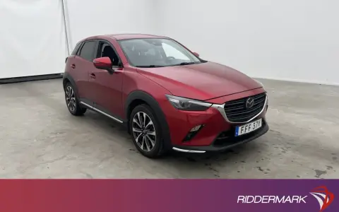Röd Mazda CX-3 begagnad test. En snygg SUV redo för nya äventyr.
