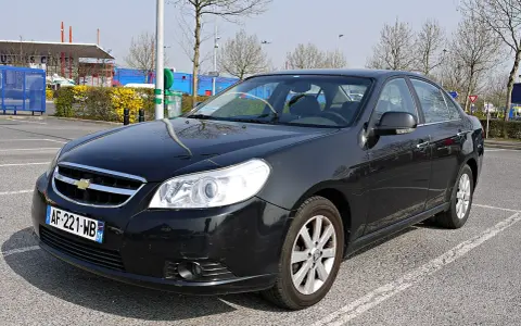 Black Chevrolet Epica sedan parked in a lot, front view.