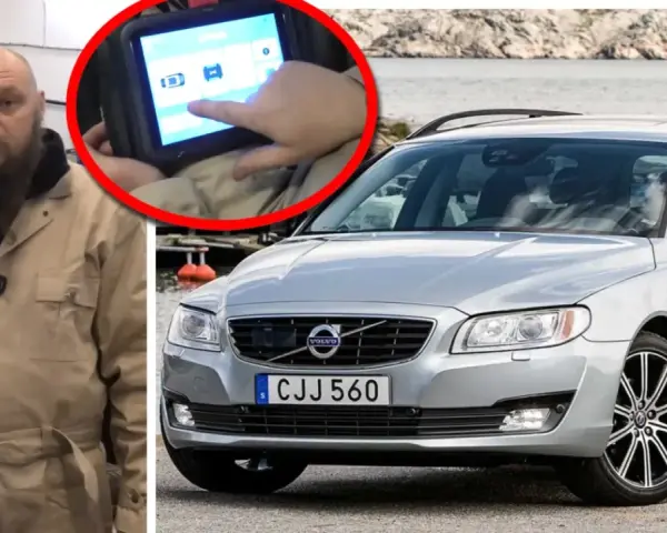 Mekaniker kollar felkoder på en Volvo V70 med en diagnosdator.