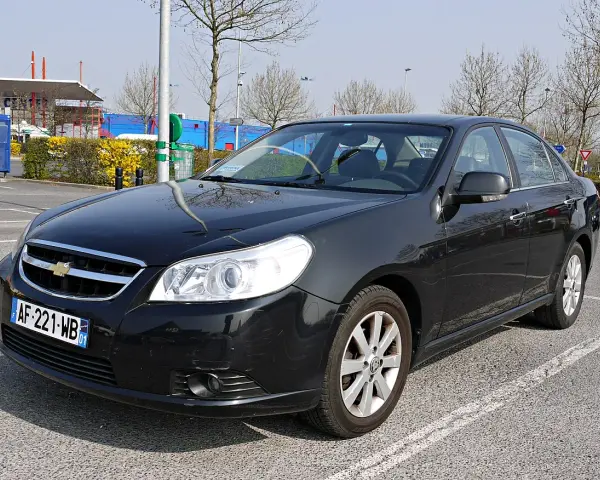 Black Chevrolet Epica sedan parked in a lot, front view.