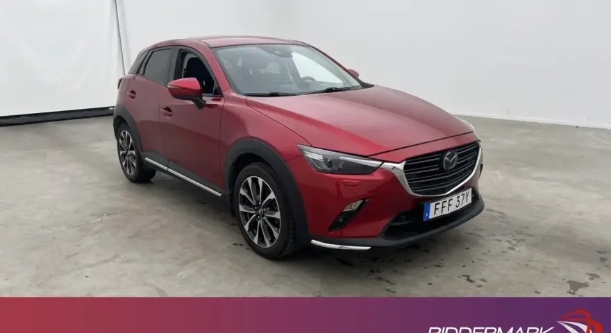 Röd Mazda CX-3 begagnad test. En snygg SUV redo för nya äventyr.