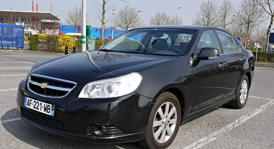 Black Chevrolet Epica sedan parked in a lot, front view.