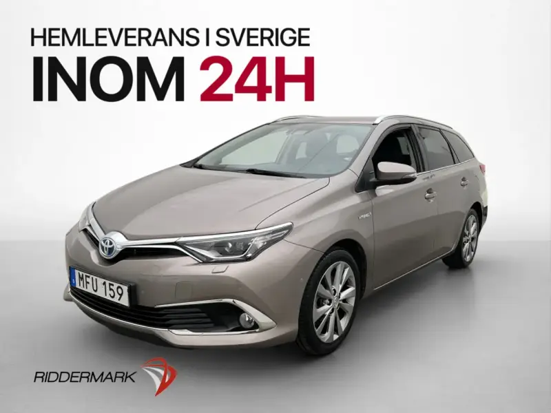 En grå Toyota Auris Hybrid kombi, redo för en testkörning i Sverige. Hemleverans inom 24h.